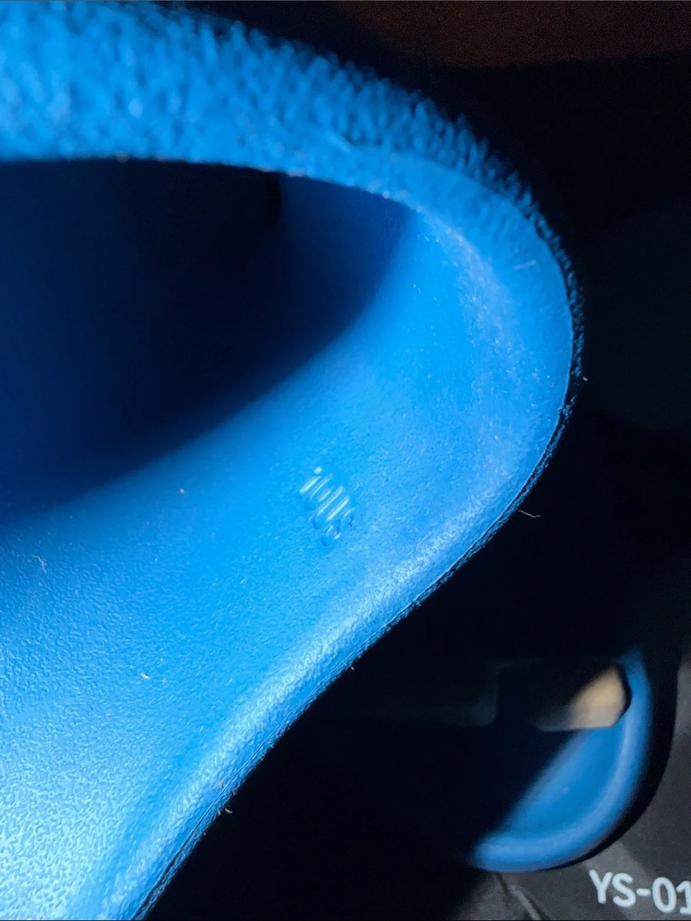 foam runner/slides inspired by Yeezy‎ designs. The bag says “YS-01,”
